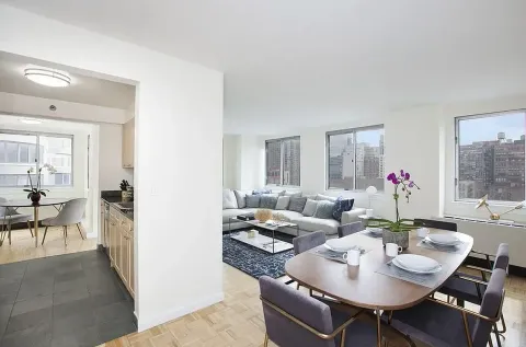 a living room with furniture and a table