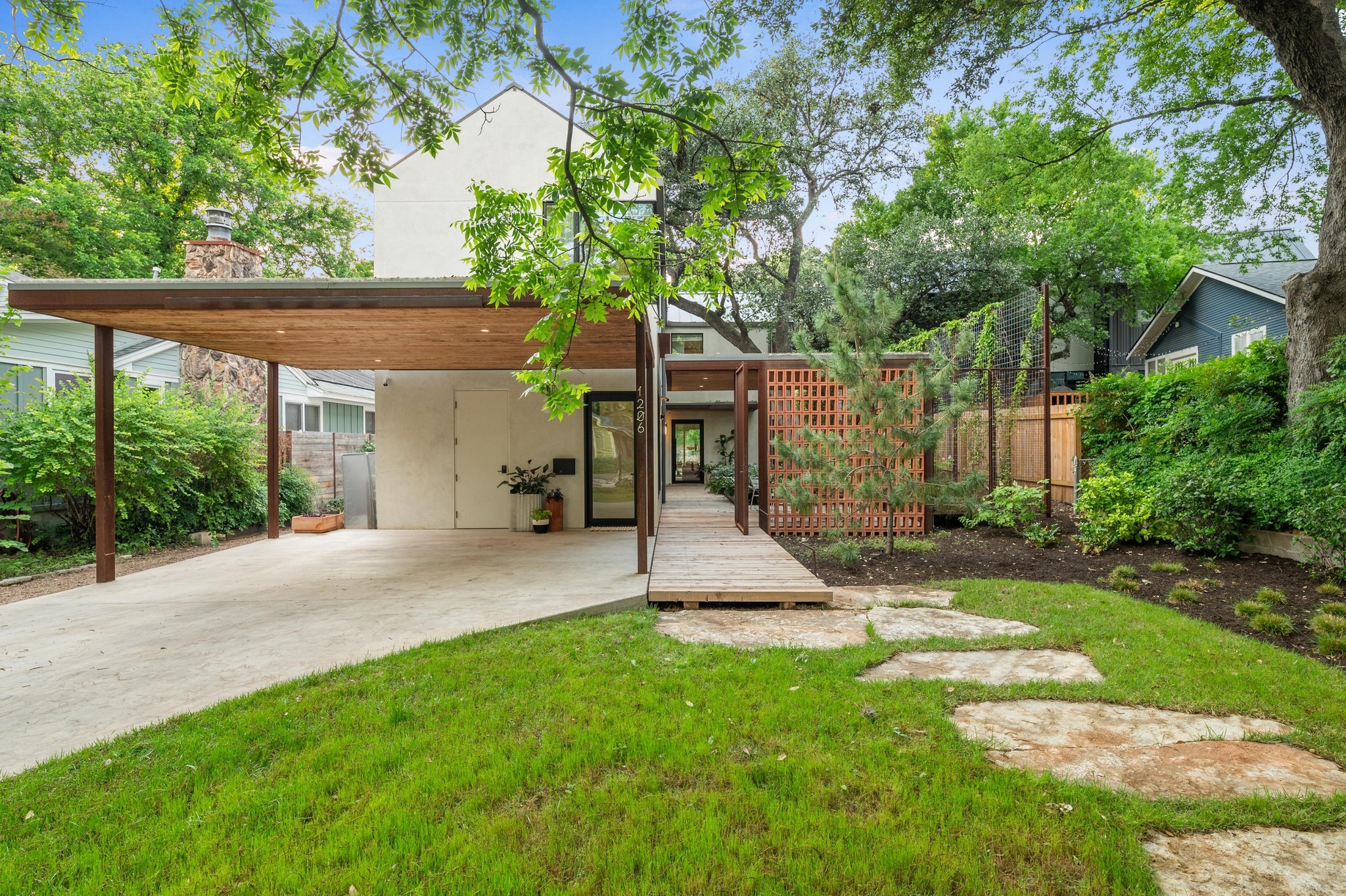 1206 Bickler Road Austin, TX 78704 - Photo 14 of 65 a view of a house with backyard and a tree