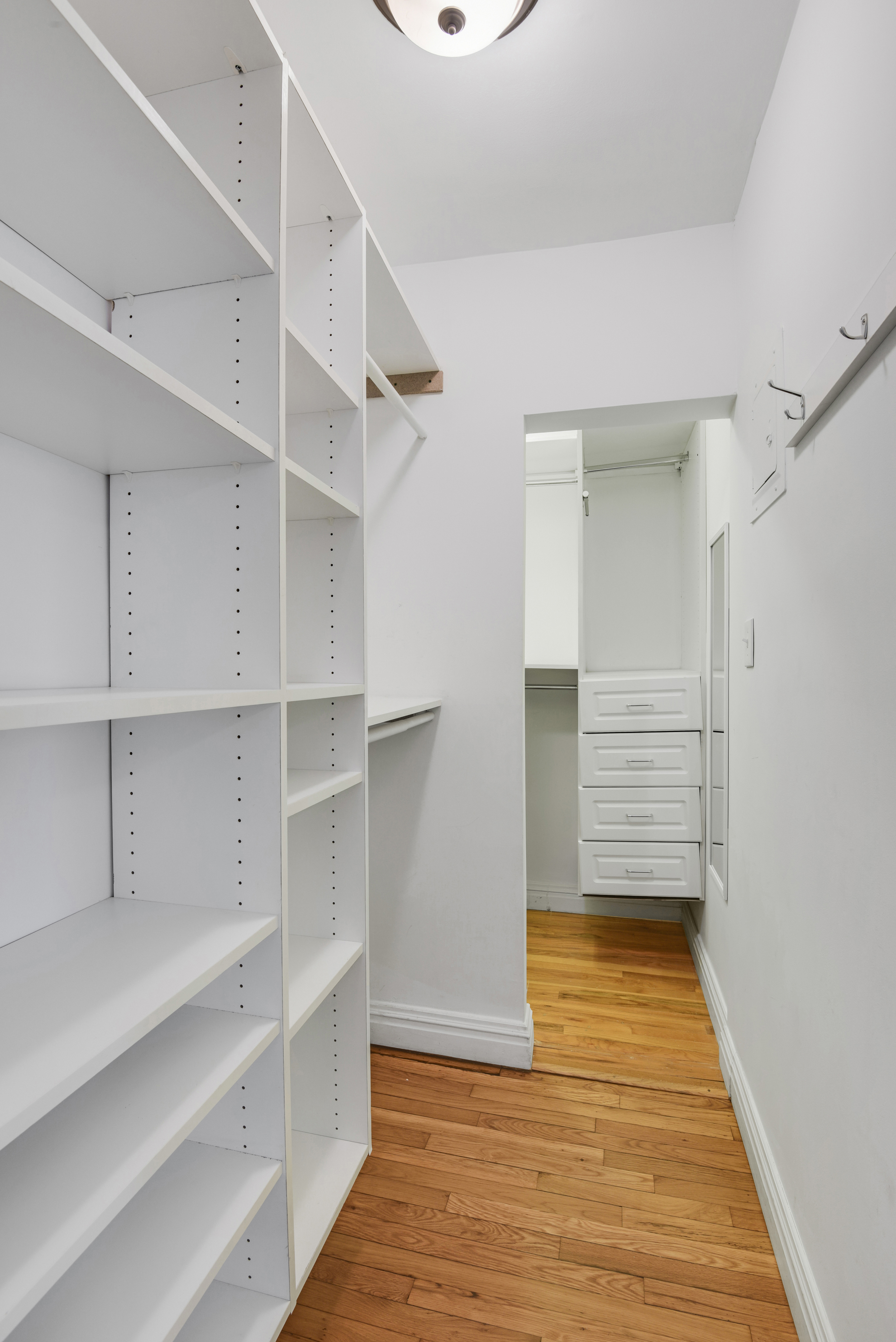 330 East 70th Street, Unit 4F Manhattan, NY 10021 - Photo 9 of 14 a view of walk in closet with empty racks