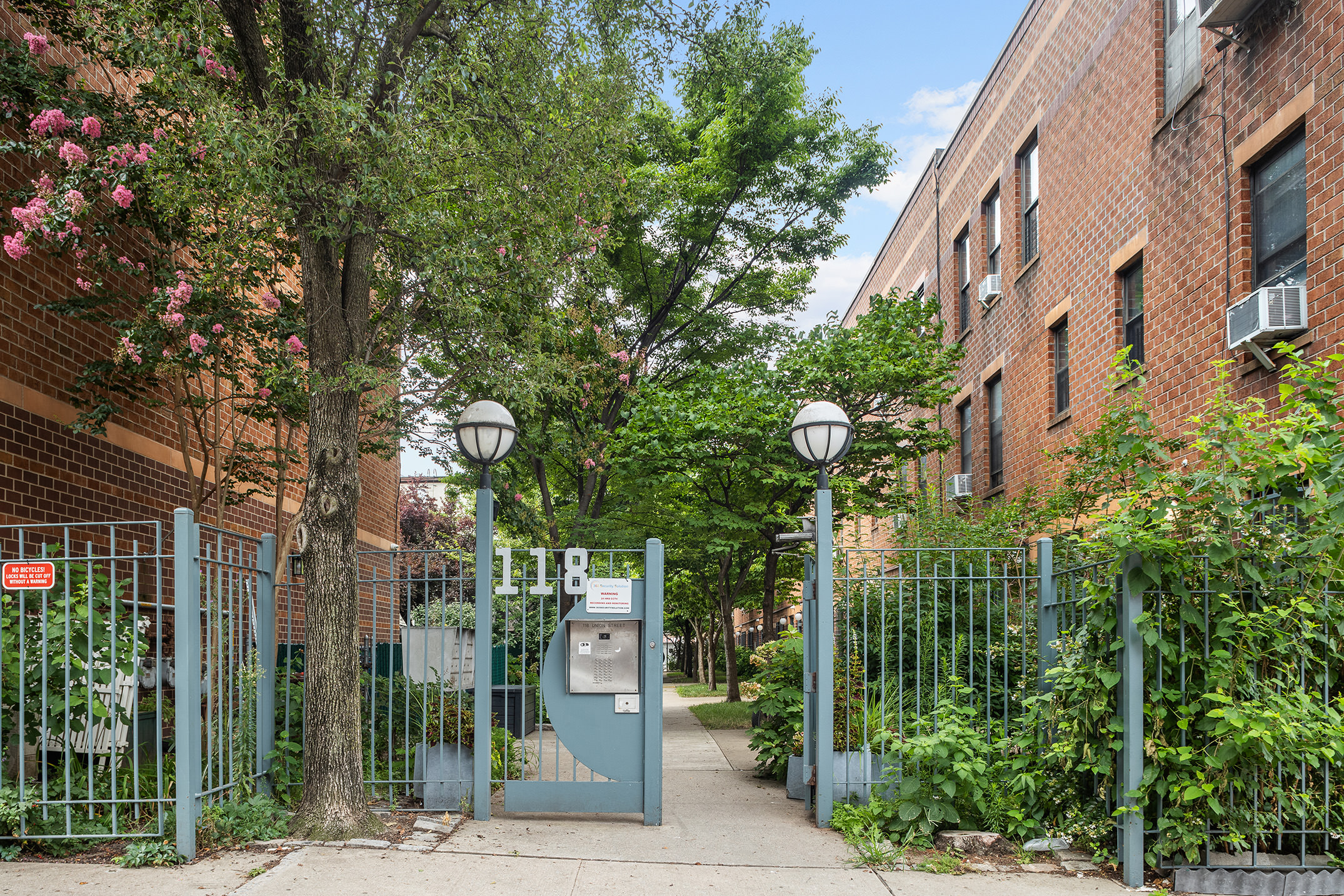 118 Union Street, Unit 9A Brooklyn, NY 11231 - Photo 7 of 10 a view of a brick building next to a road