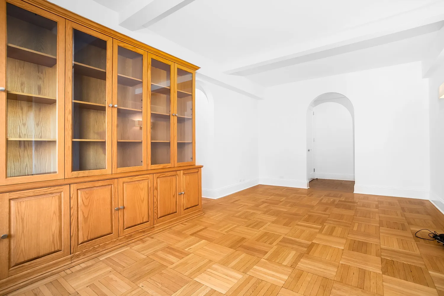 a view of an empty room with a window