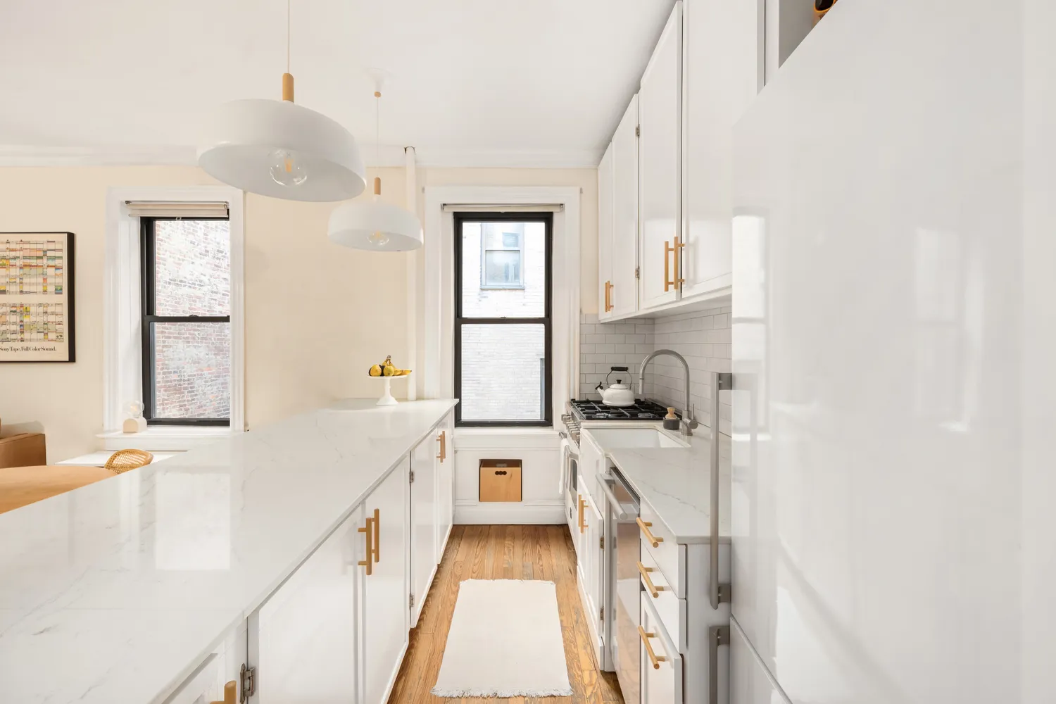a kitchen with a sink a stove and cabinets