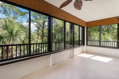 a view of an empty room with a large window
