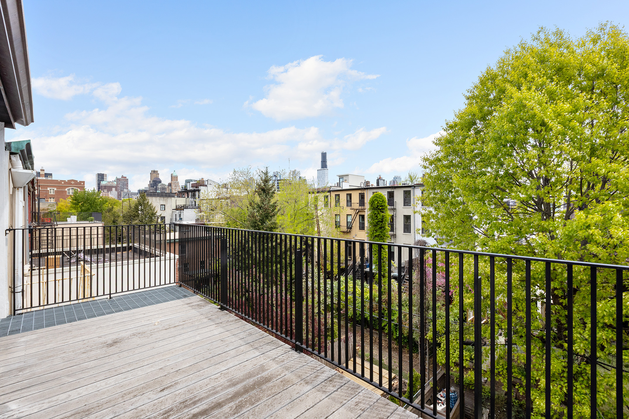 479 Henry Street Brooklyn, NY 11231 - Photo 22 of 30 a view of a balcony with wooden fence
