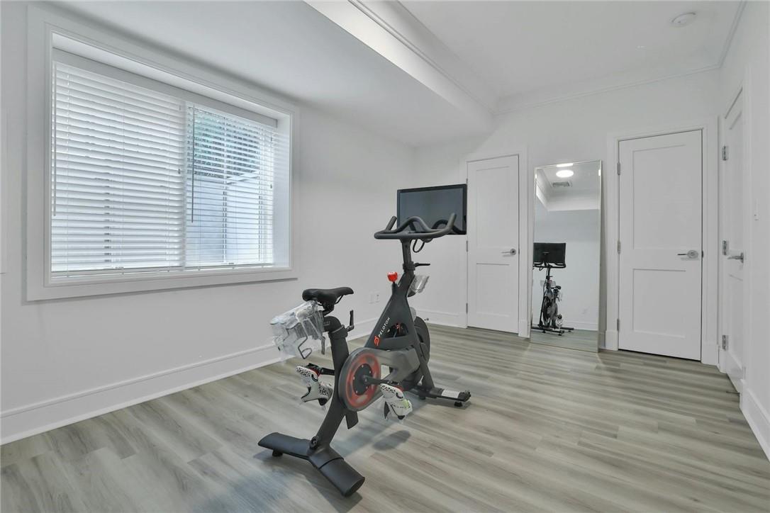 211 Purchase Street, Unit A Rye, NY 10580 - Photo 20 of 22 a view of a room with gym equipment and windows