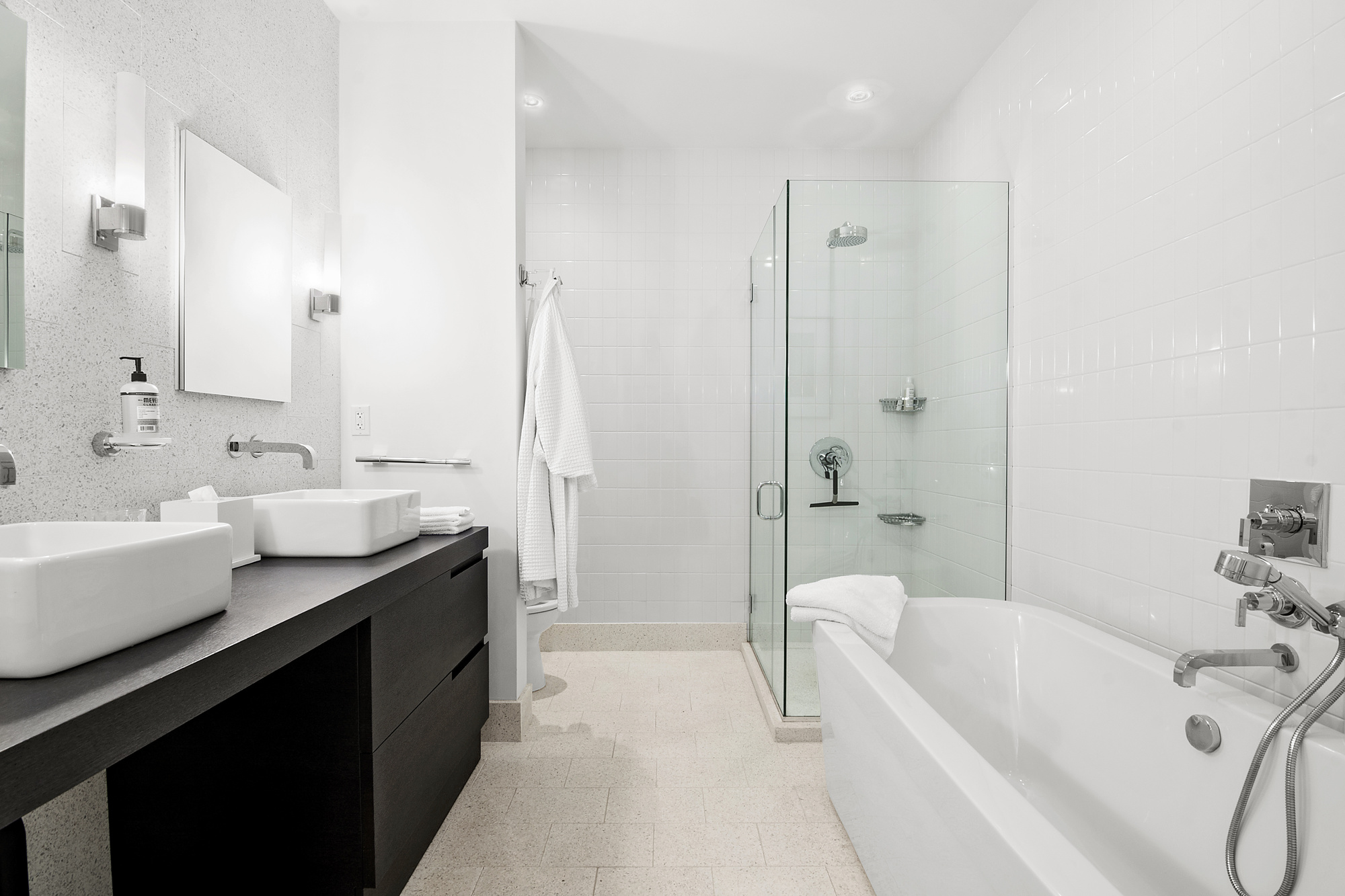 360 Furman Street, Unit 1036 Brooklyn, NY 11201 - Photo 8 of 45 a bathroom with a tub sink double vanity and mirror