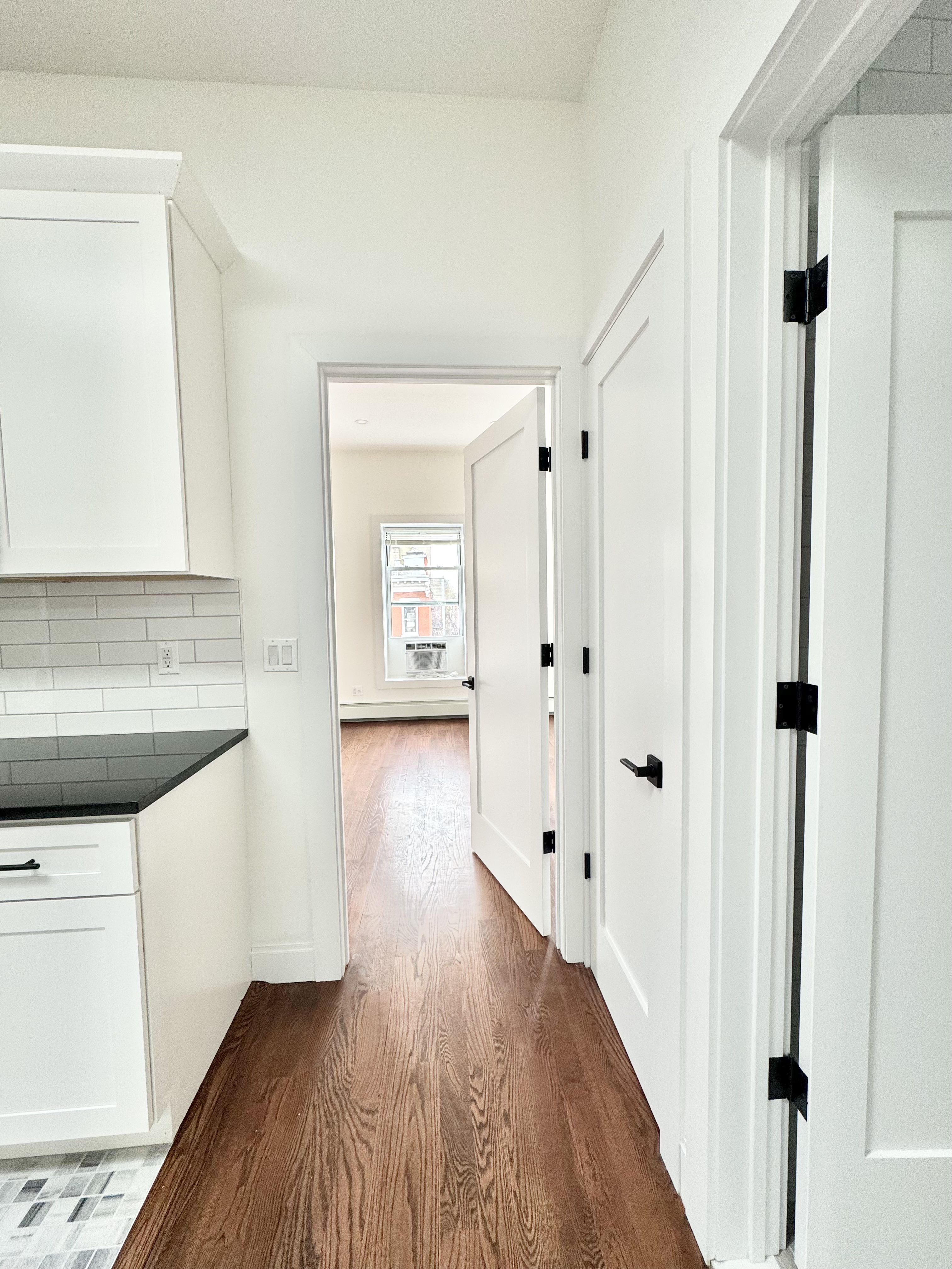 383 Myrtle Avenue, Unit 3 Brooklyn, NY 11205 - Photo 21 of 21 a view of a hallway with wooden floor and cabinet
