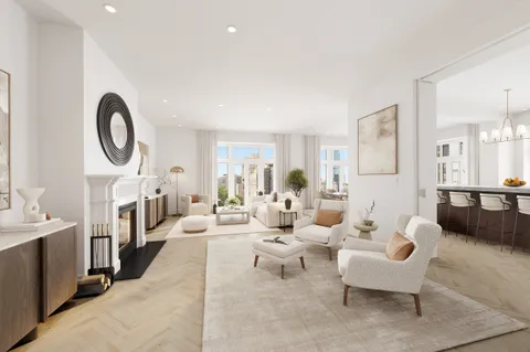 a living room with fireplace furniture and a large window