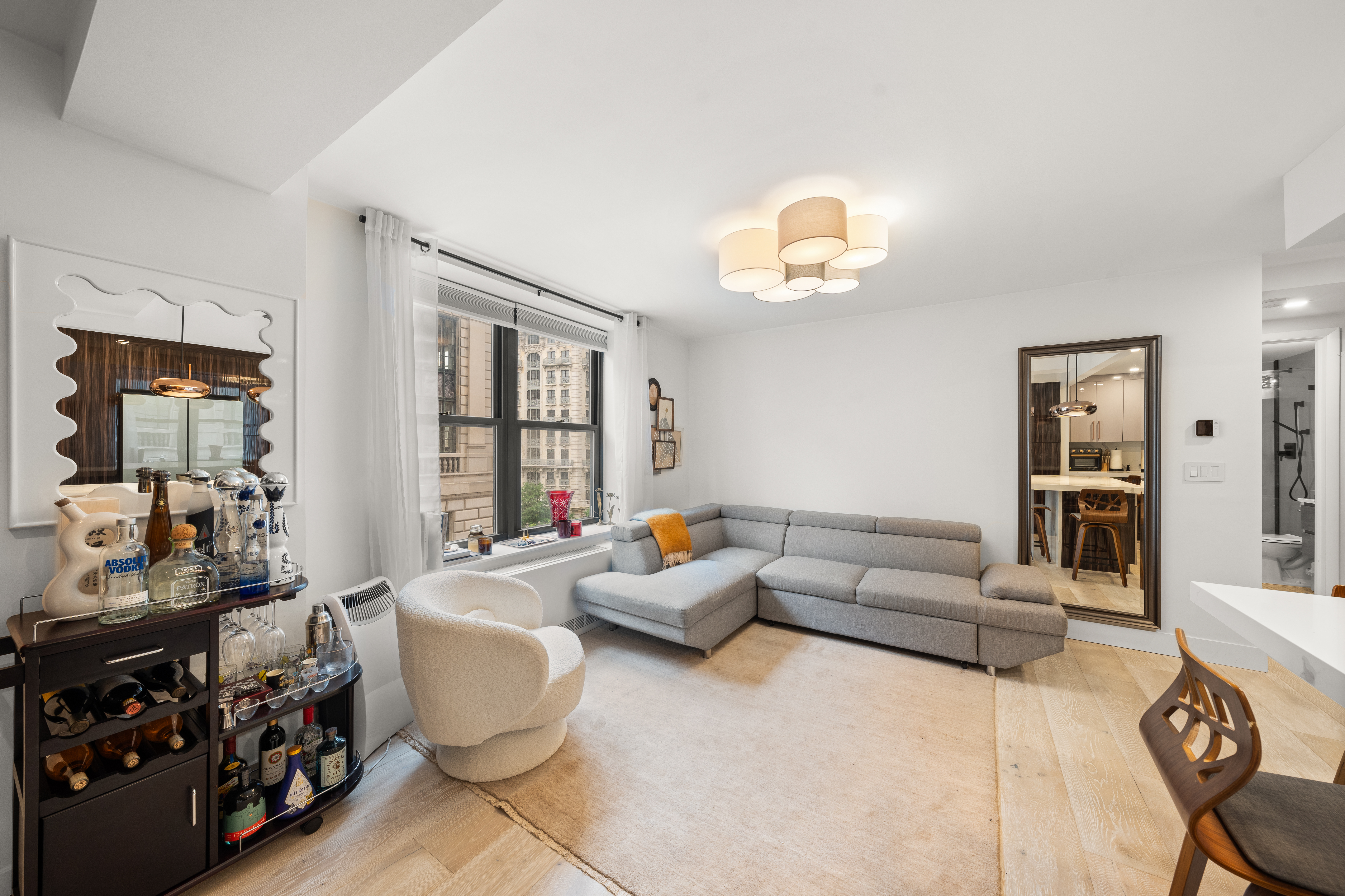 201 West 74th Street, Unit G8 Manhattan, NY 10023 - Photo 4 of 12 a living room with furniture and a window