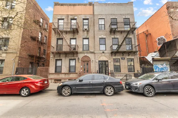a car parked in front of a buildings