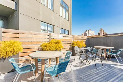 a view of a swimming pool with outdoor seating