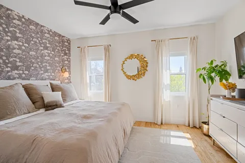 a bedroom with a bed and a window