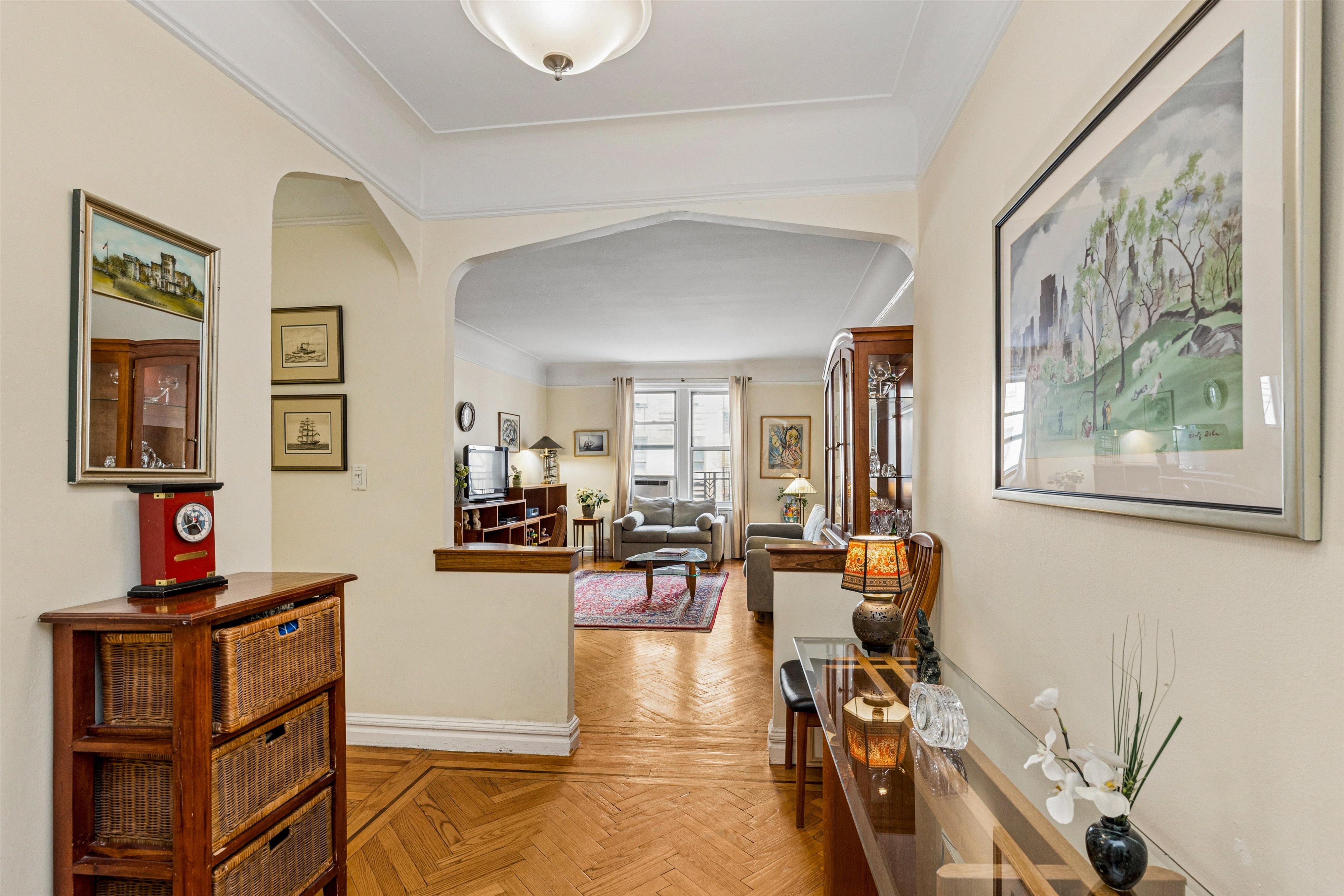 680 West 204th Street, Unit 4F Manhattan, NY 10034 - Photo 4 of 21 a living room with furniture and wooden floor