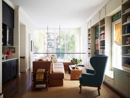 a living room with furniture and a window