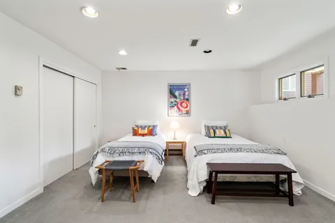 a bedroom with a bed and a table in it