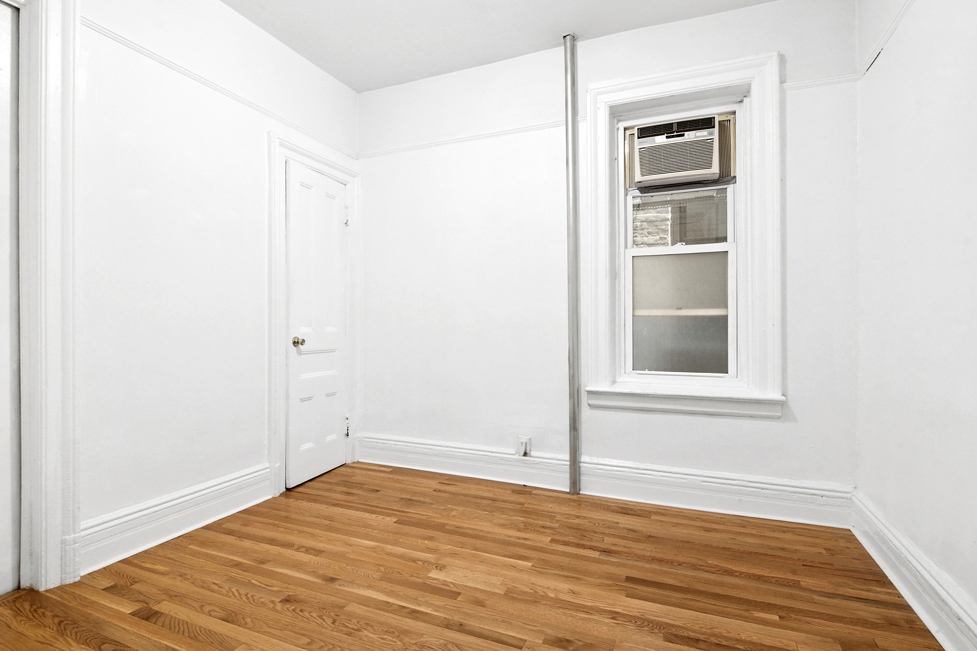 271 6th Avenue, Unit 2 Brooklyn, NY 11215 - Photo 4 of 8 a view of empty room with wooden floor