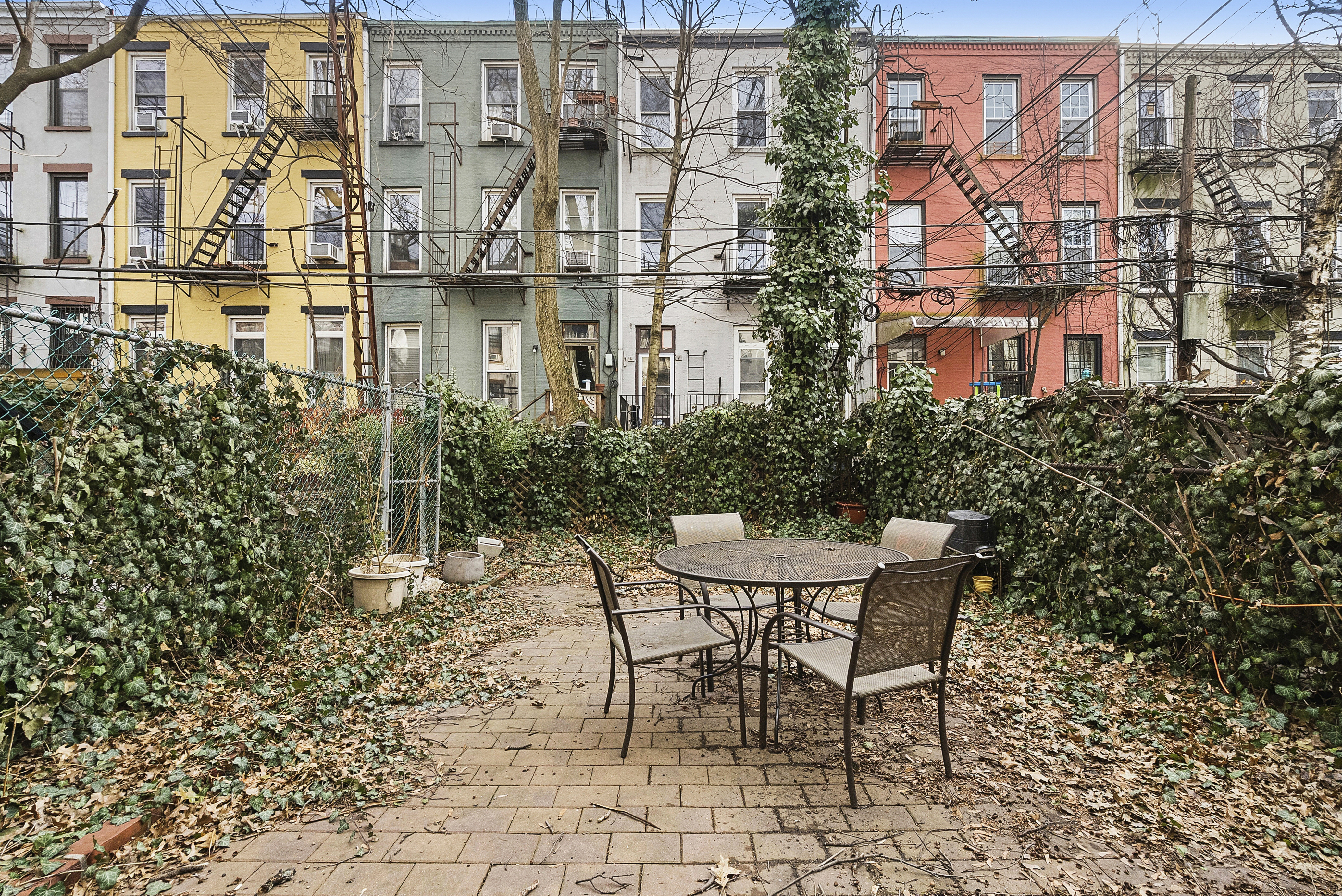 460 9th Street Brooklyn, NY 11215 - Photo 23 of 24 a patio with table and chairs and potted plants