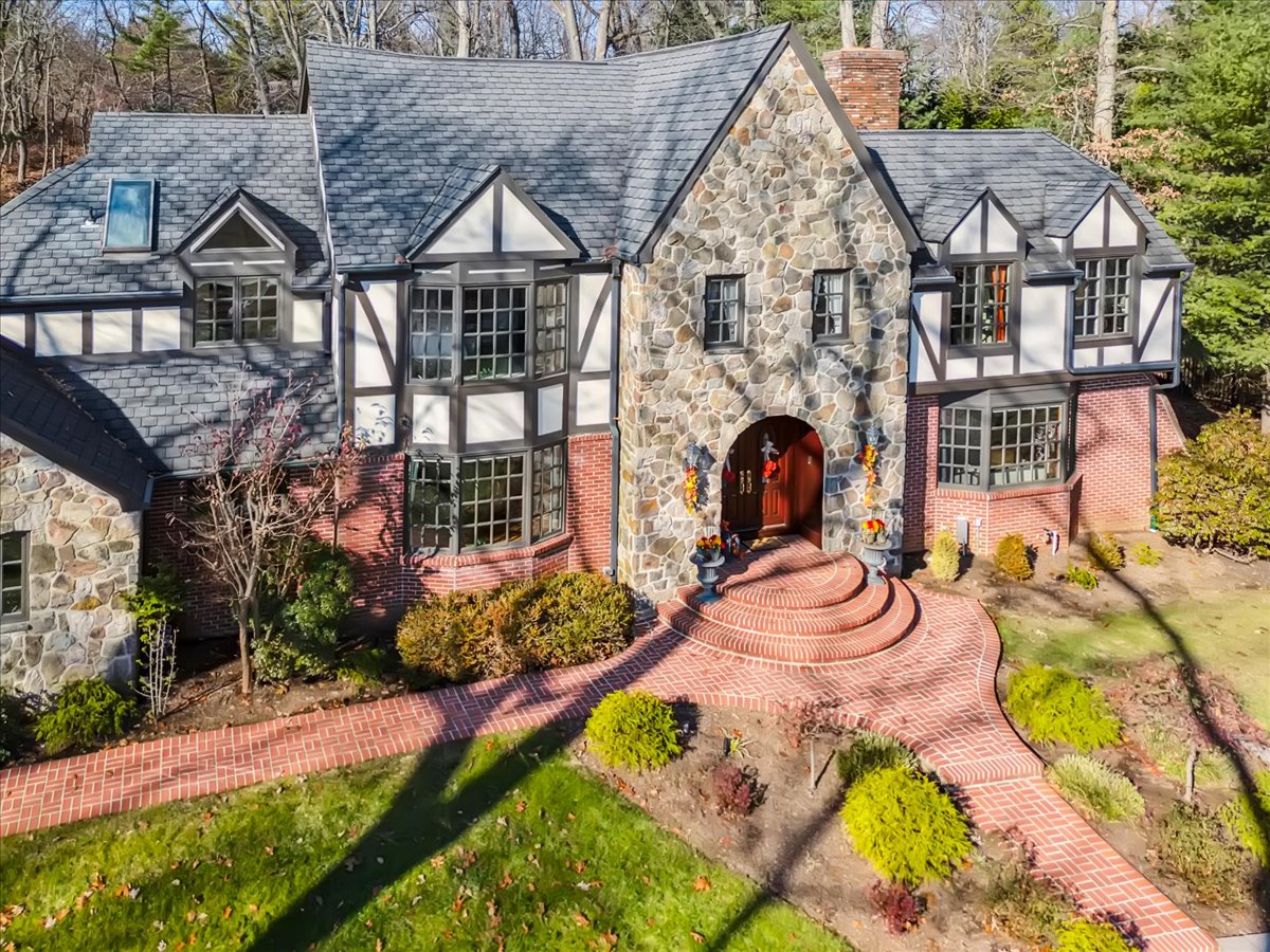 Johnston Drive Watchung, NJ 07069 - Photo 8 of 85 an aerial view of a house with swimming pool and garden