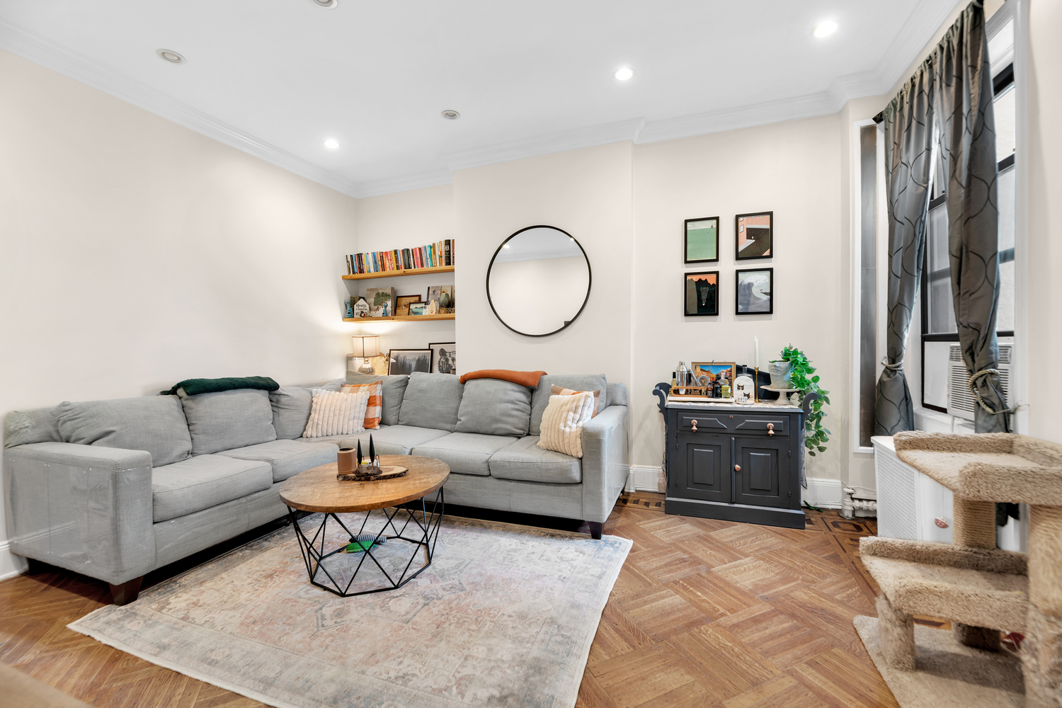571 8th Street Brooklyn, NY 11215 - Photo 4 of 13 a living room with furniture a rug and a mirror