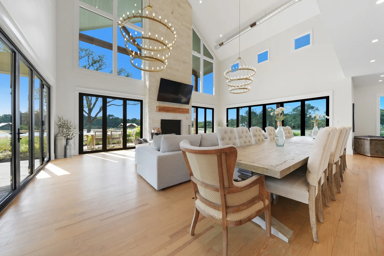 a spacious bathroom with a granite countertop sink a mirror a vanity and a shower