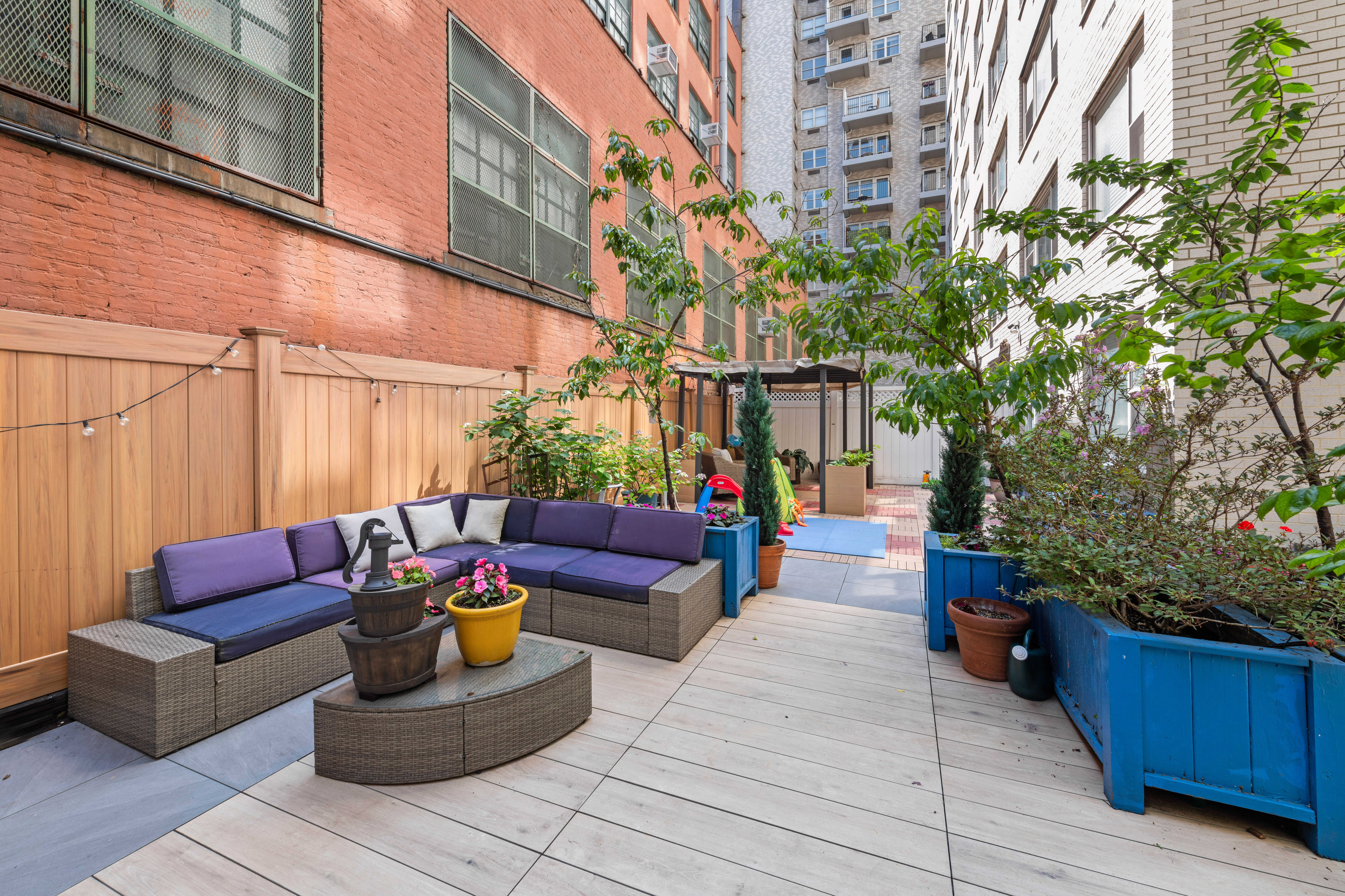 400 East 77th Street, Unit 1CD Manhattan, NY 10075 - Photo 3 of 18 a building outdoor space with patio furniture