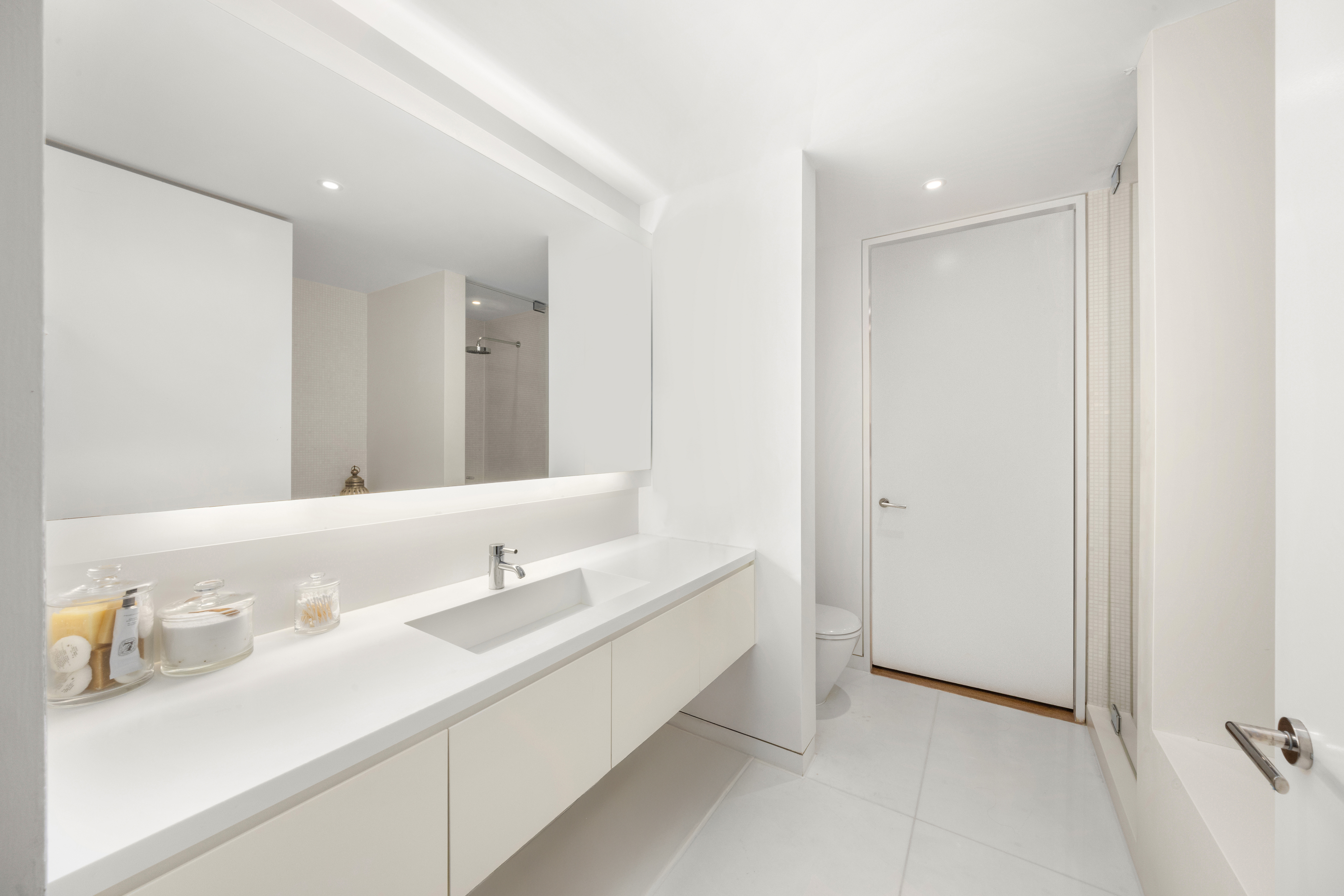1 Grand Army Plaza, Unit 3C Brooklyn, NY 11238 - Photo 11 of 23 a bathroom with a double vanity sink and a mirror