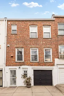 a front view of a building with many windows