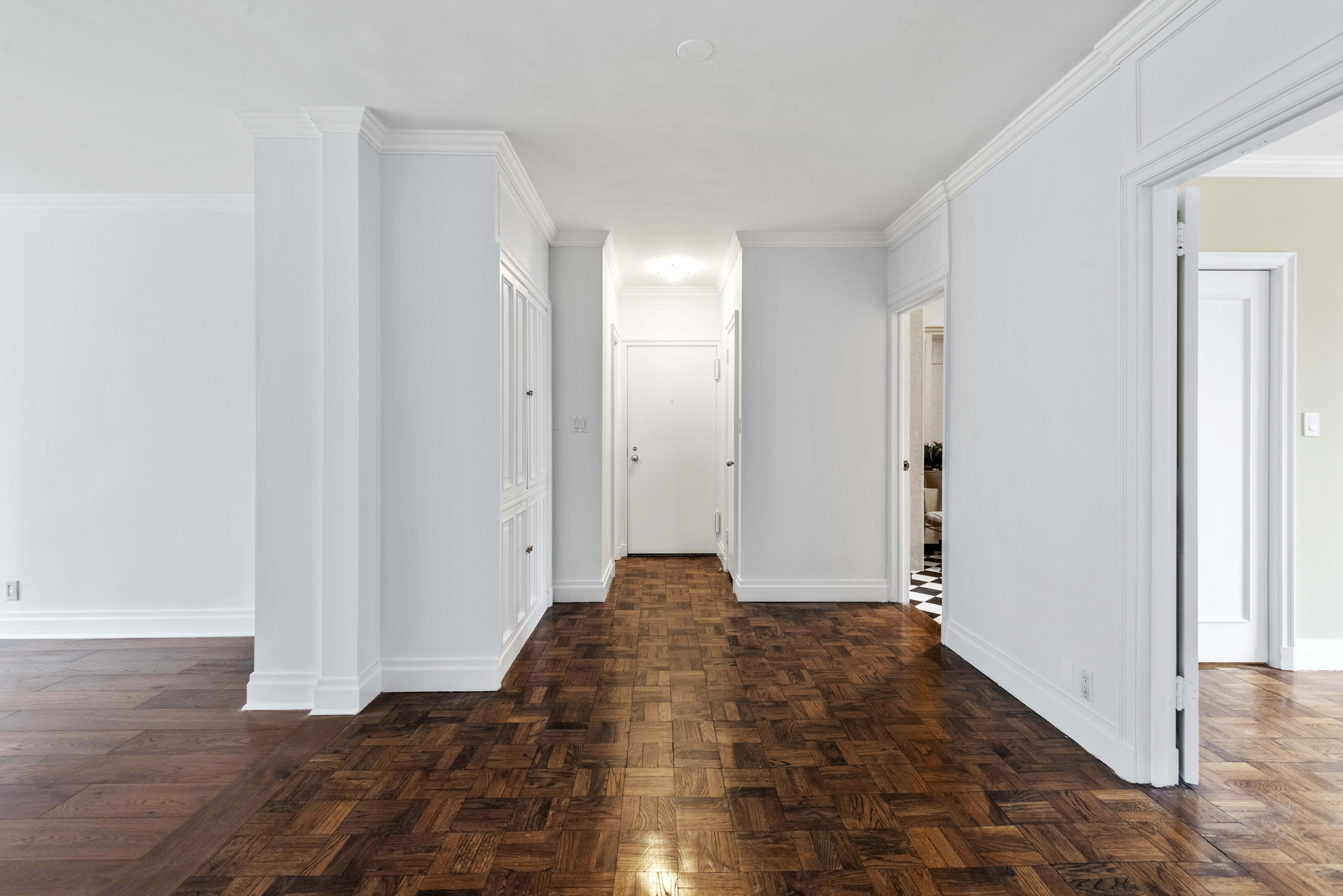 175 East 62nd Street, Unit 12A Manhattan, NY 10065 - Photo 15 of 24 a view of bedroom with wooden floor