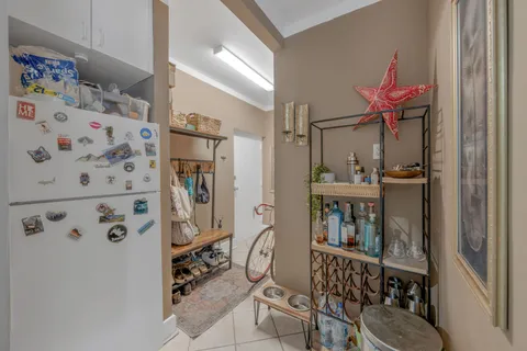 a kitchen with stainless steel appliances granite countertop a refrigerator and a wooden cabinets