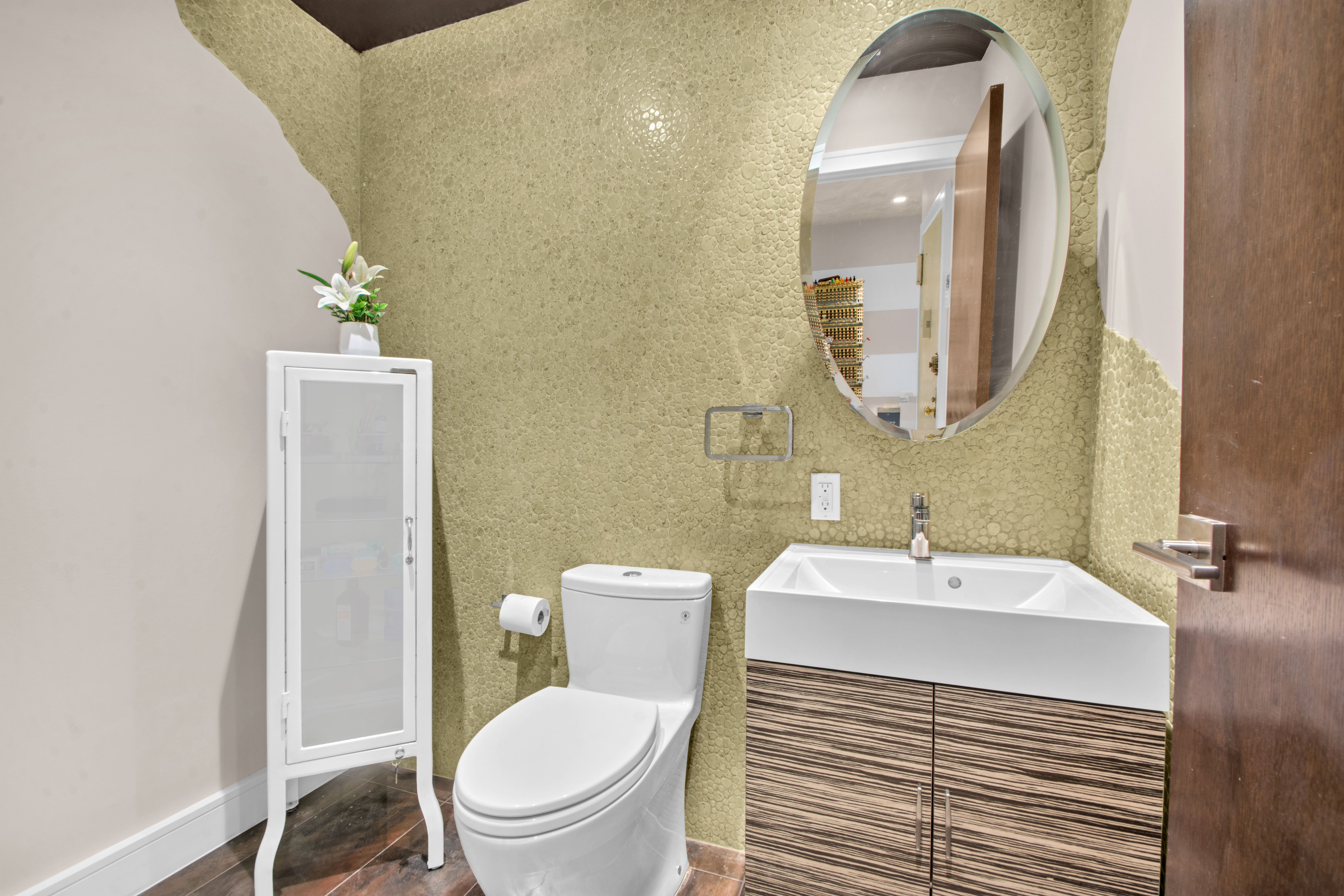 690 Washington Street, Unit 1A Manhattan, NY 10014 - Photo 14 of 17 a bathroom with a sink a toilet and a mirror