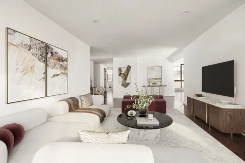 a living room with furniture a flat screen tv and a large window