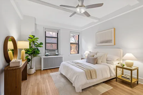 a bedroom with a bed furniture and a window