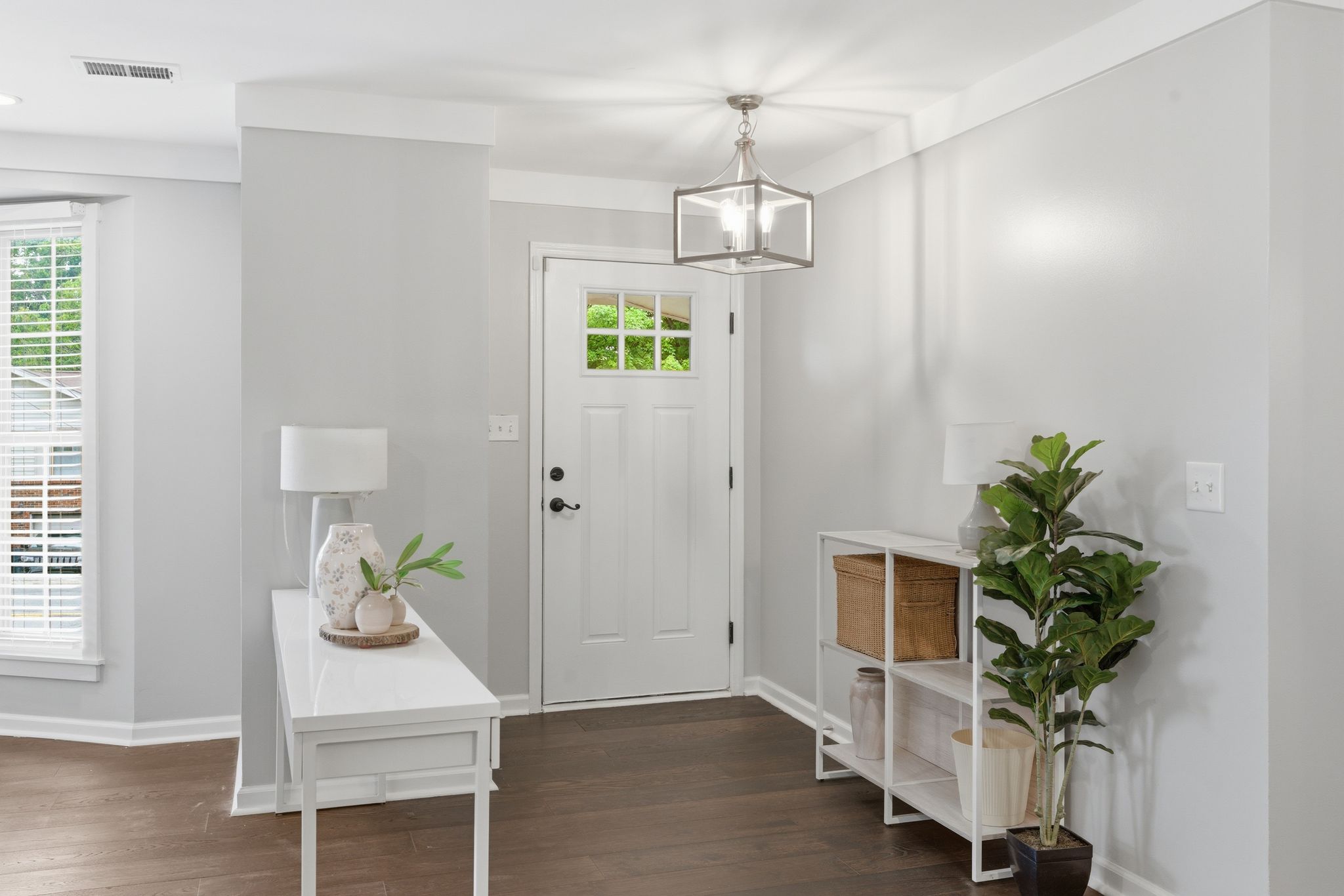 307 Paragon Mills Road Nashville, TN 37211 - Photo 3 of 29 a view of a hallway with wooden floor and a chandelier