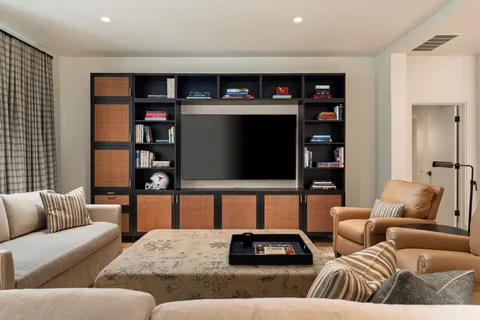 a living room with a couch and a fireplace