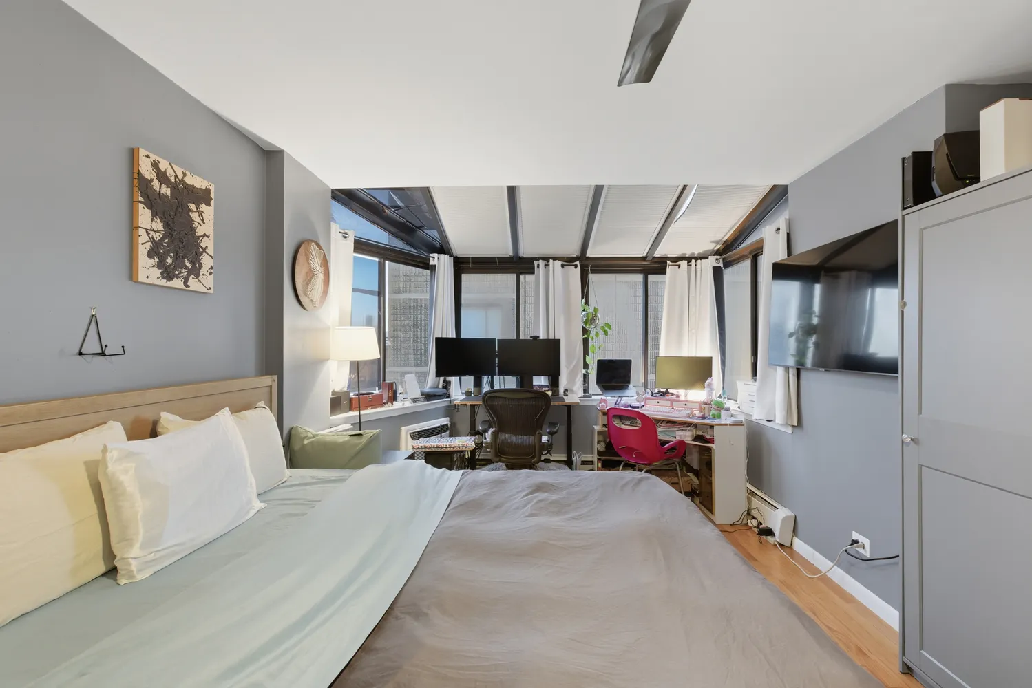 a bedroom with furniture window and a couch