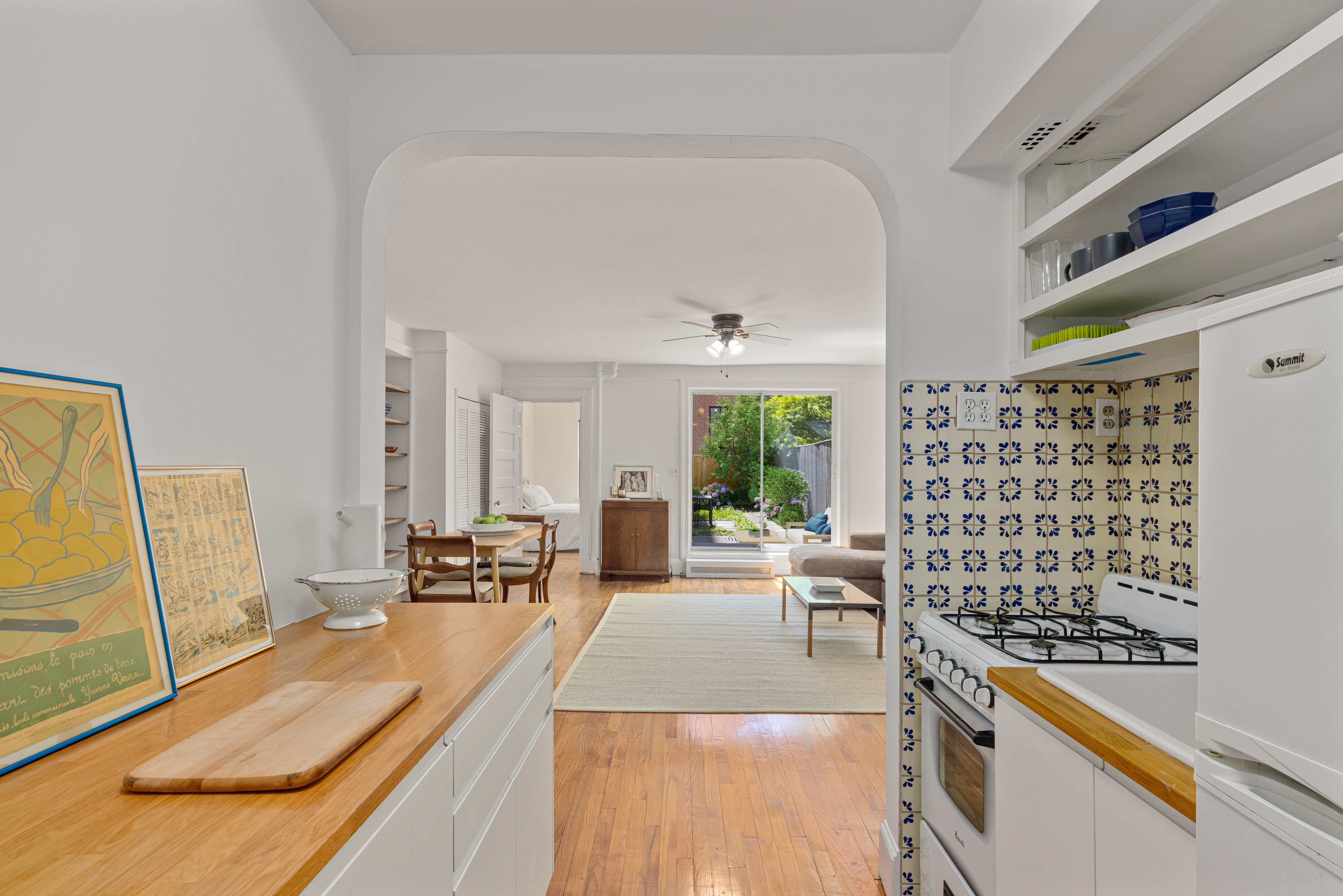 322 West 88th Street, Unit B Manhattan, NY 10024 - Photo 3 of 8 a living room with furniture a large window and wooden floor