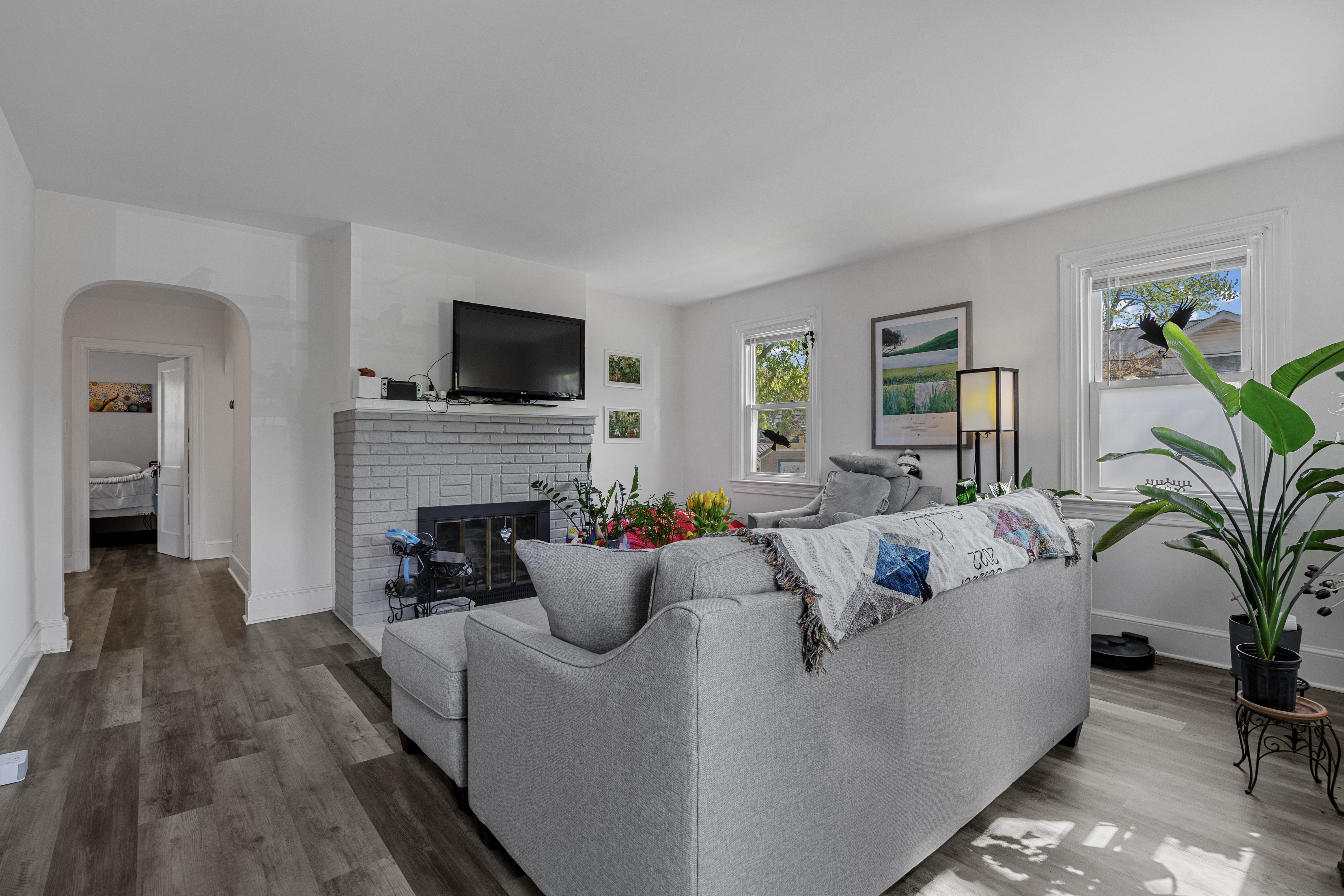 34 East Walnut Street Alexandria, VA 22301 - Photo 2 of 15 a living room with furniture a flat screen tv and a fireplace