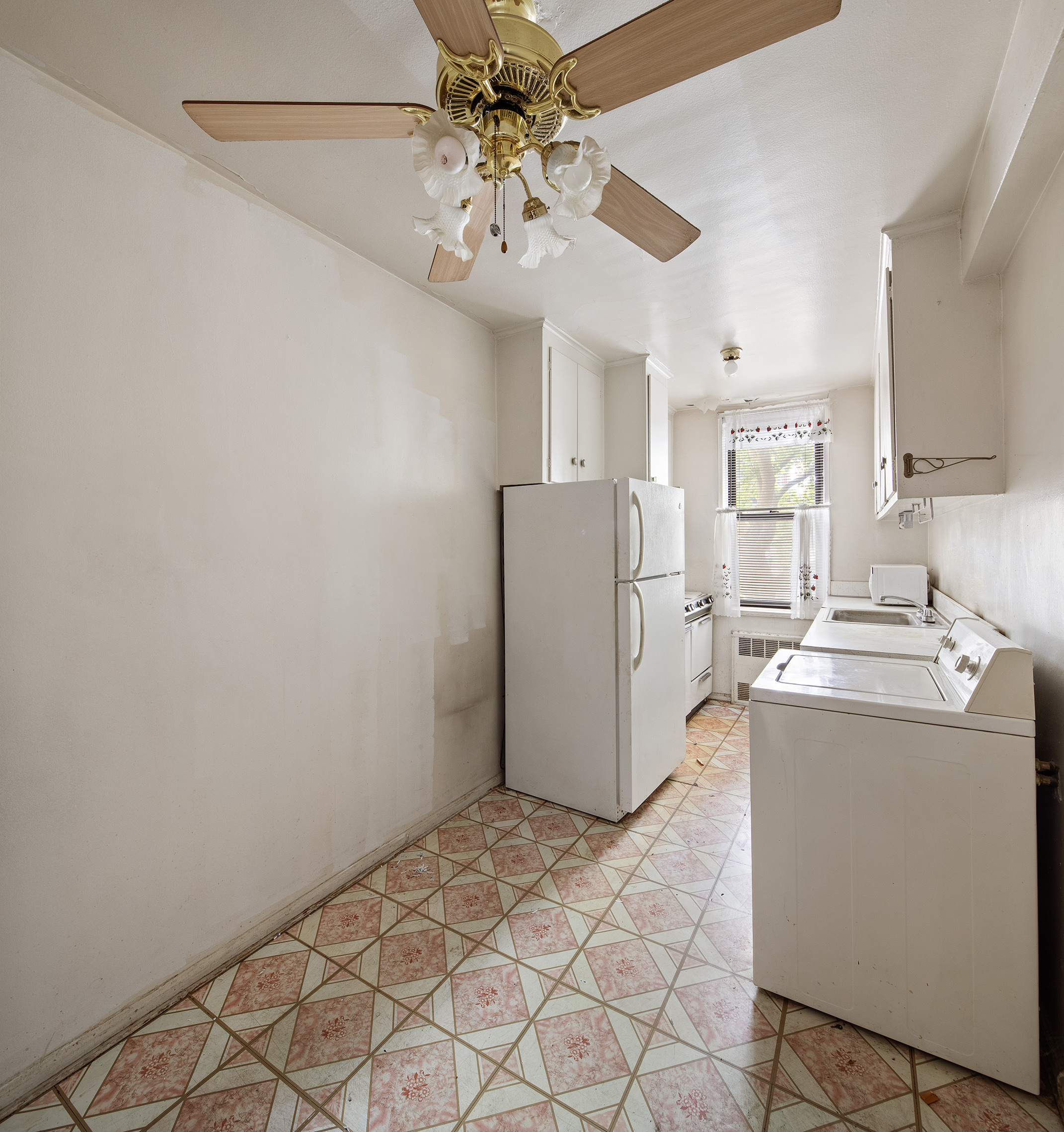 345 Webster Avenue, Unit 1U Brooklyn, NY 11230 - Photo 7 of 10 a room with a refrigerator and a sink