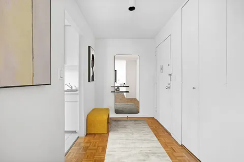 a bathroom with a tub and mirror