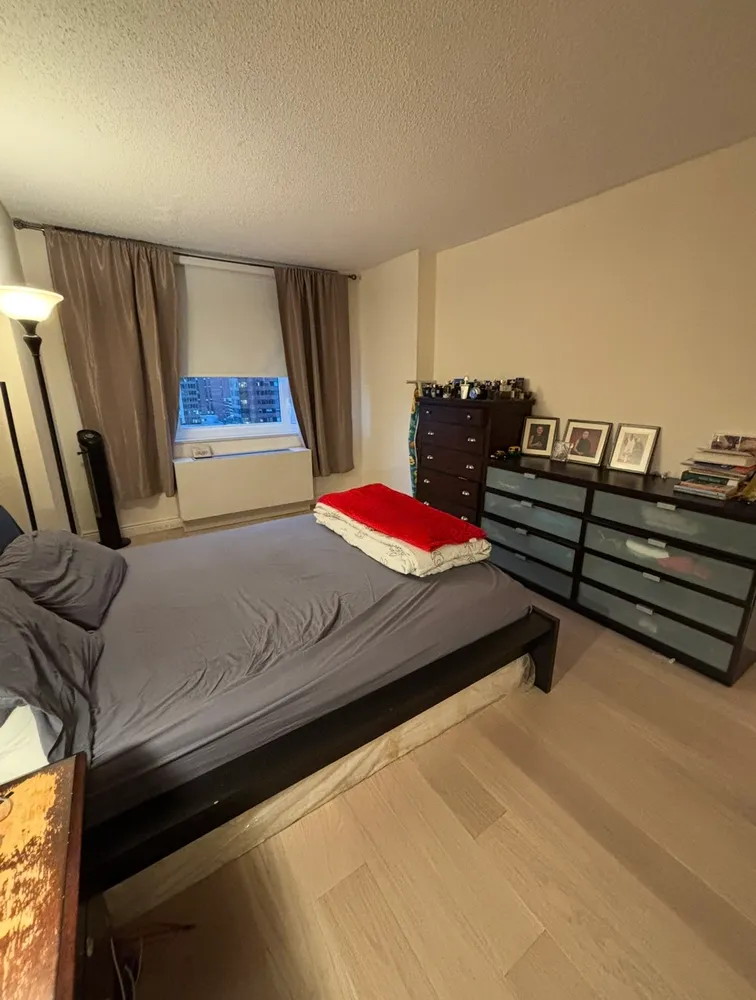 a picture of a bathroom with a shower and mirror