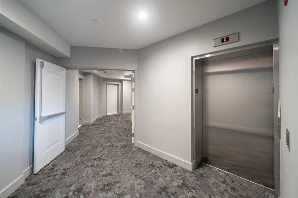 a view of a hallway with closet