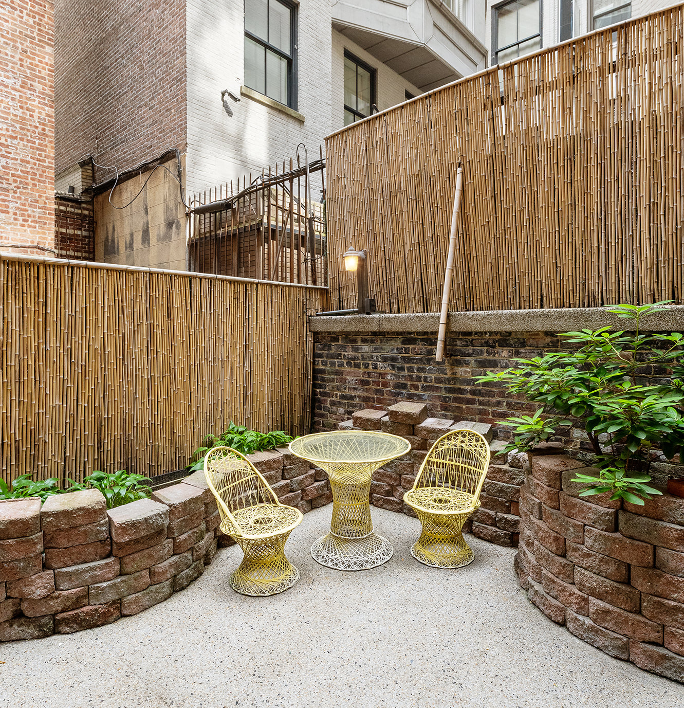 23 East 81st Street, Unit 1 Manhattan, NY 10028 - Photo 21 of 23 a view of a patio with table and chairs