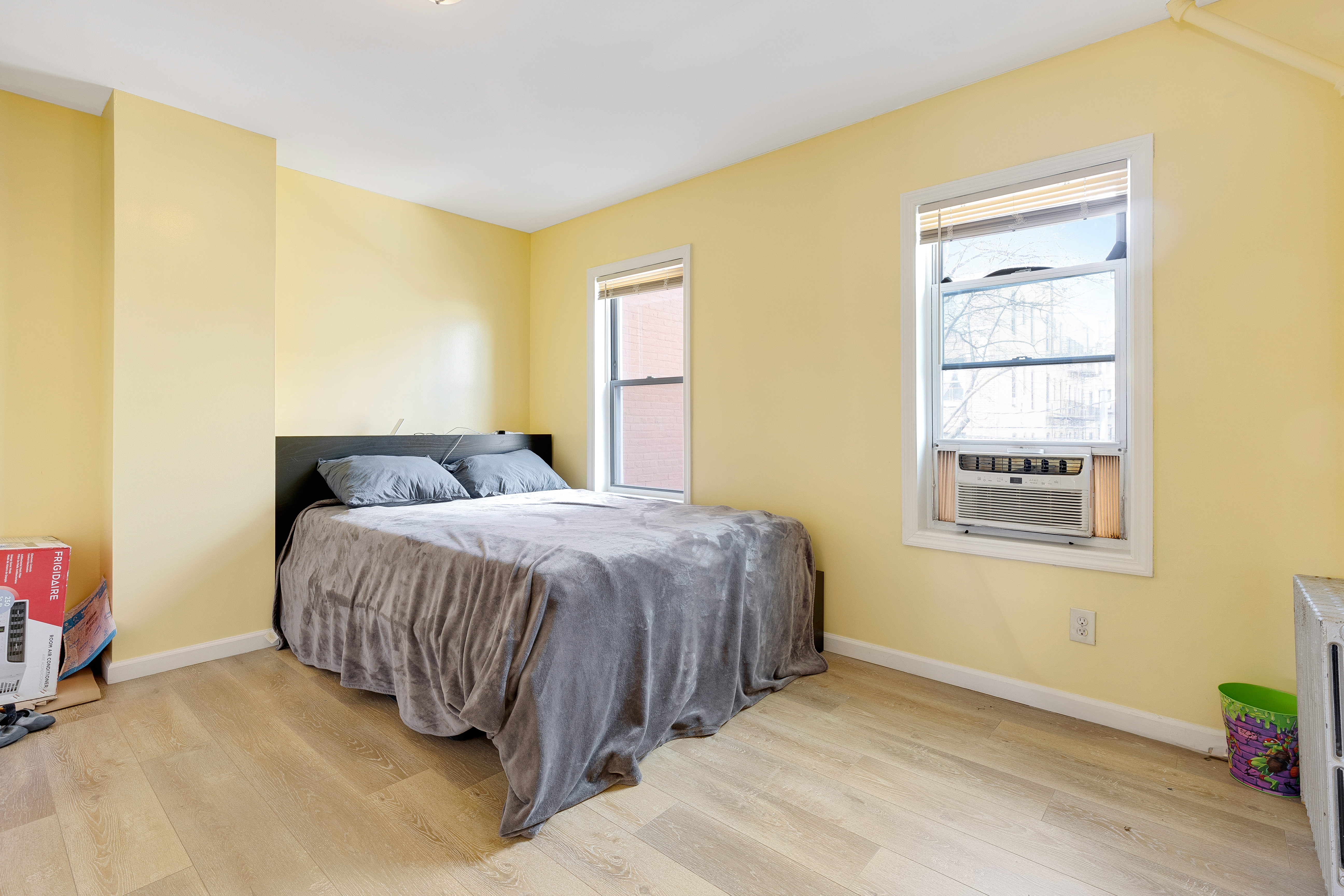 35-47 30th Street Queens, NY 11106 - Photo 3 of 14 a bedroom with a bed and a window