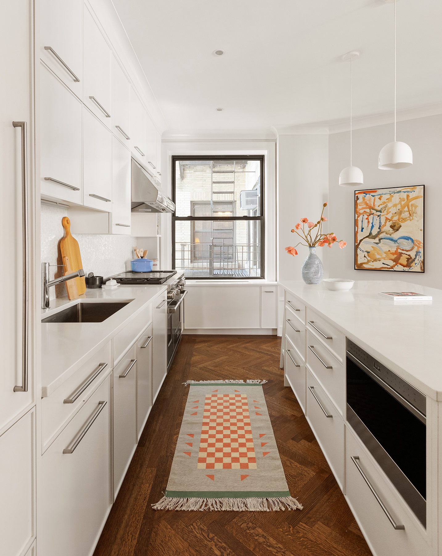 251 West 89th Street, Unit 4D Manhattan, NY 10024 - Photo 6 of 20 a large white kitchen with a stove a sink and a window