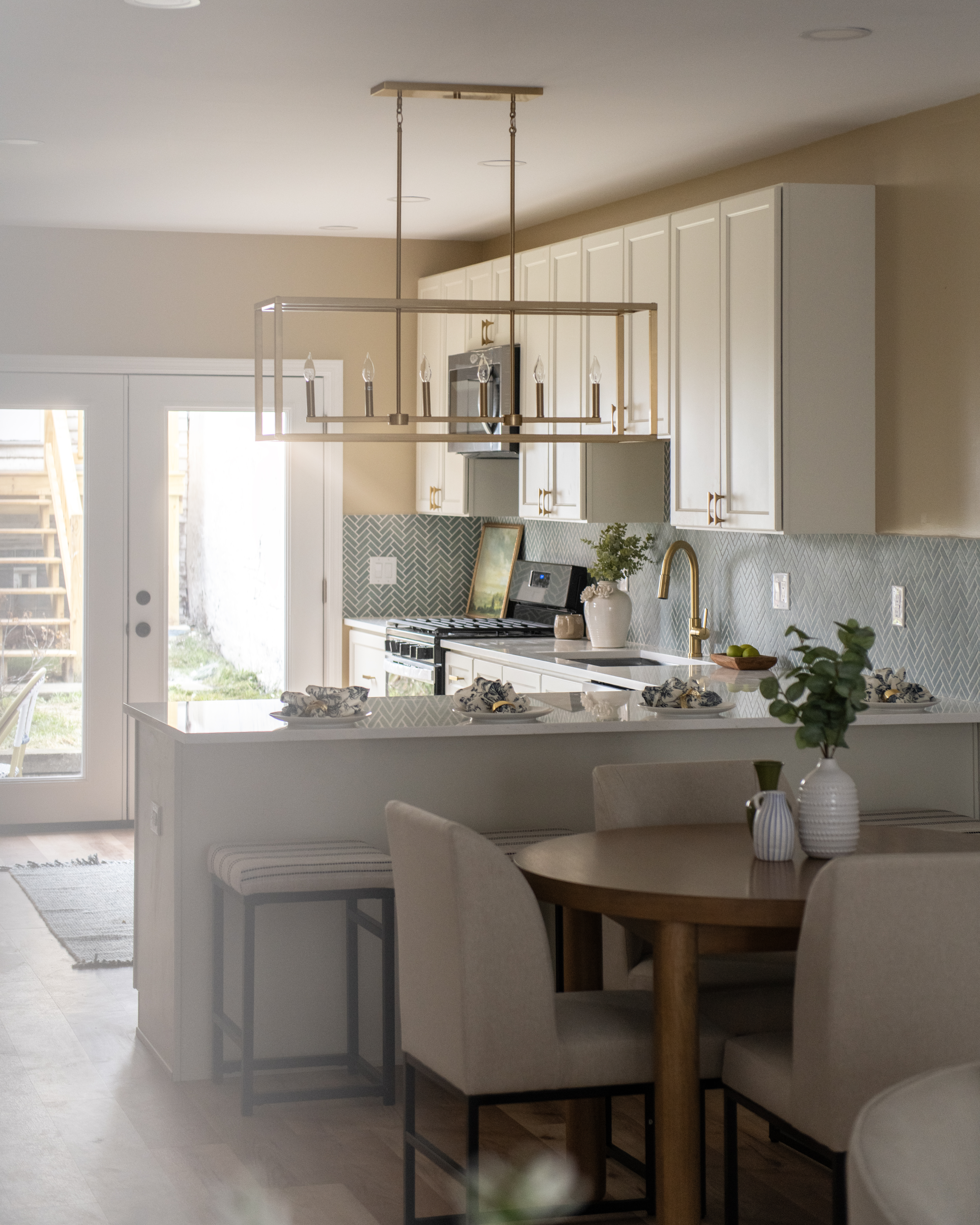 5412 Carnegie Street Pittsburgh, PA 15201 - Photo 21 of 55 a kitchen with a table chairs stove and cabinets