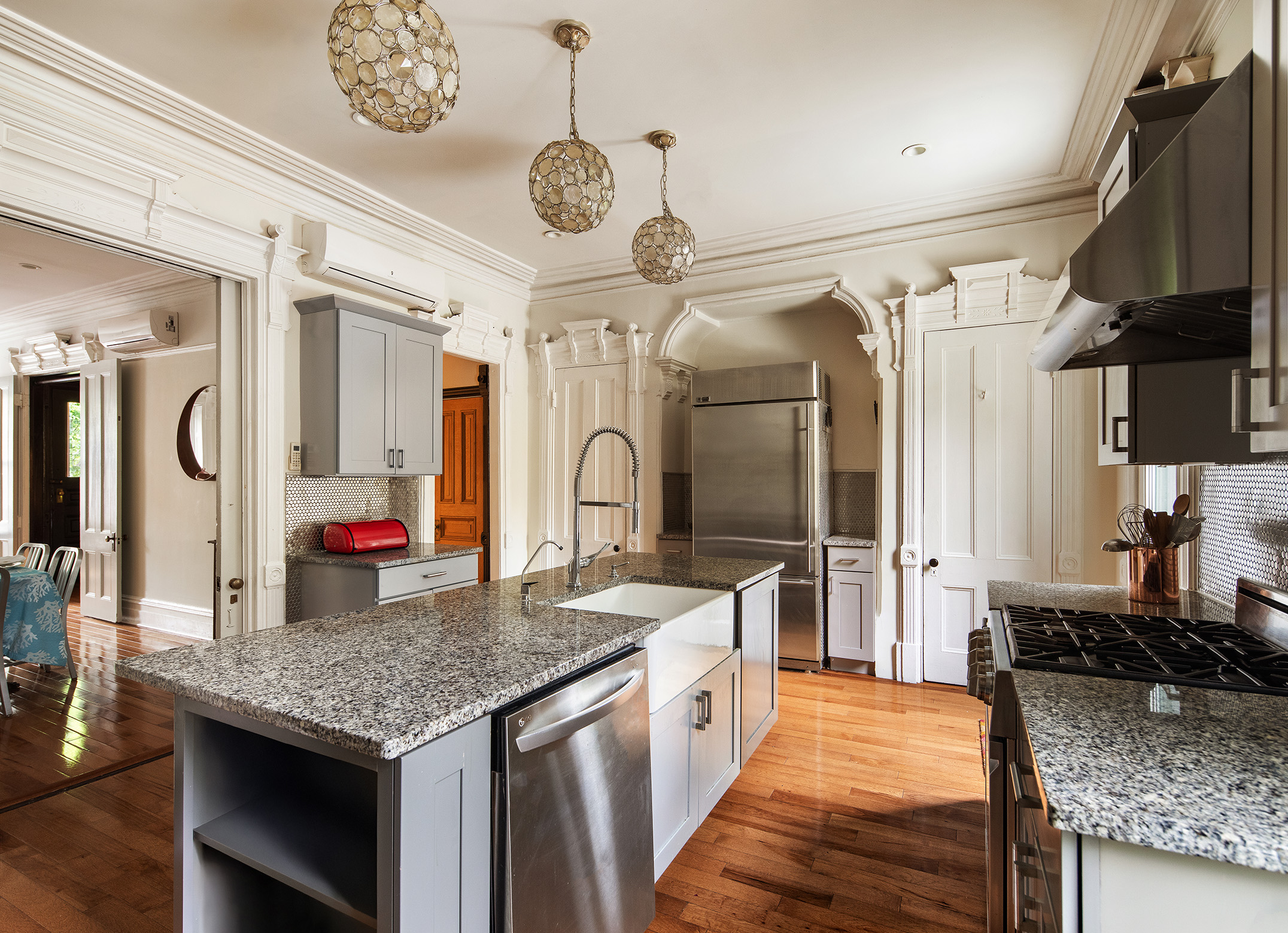 183 Halsey Street Brooklyn, NY 11216 - Photo 6 of 23 a large kitchen with a stove and a center island