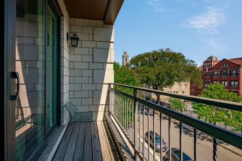 a view of a balcony with wooden floor