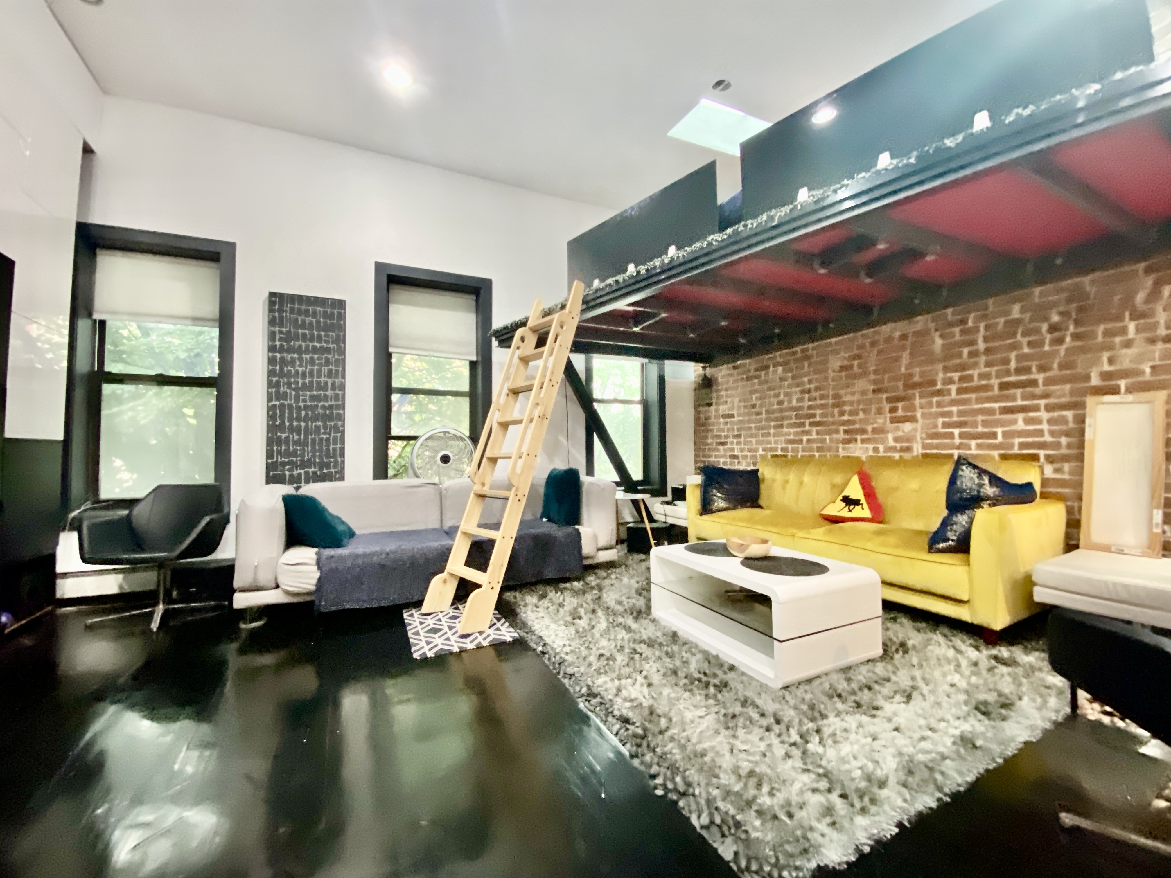420 Kosciuszko Street, Unit 3 Brooklyn, NY 11221 - Photo 5 of 8 a living room with fireplace furniture and a large window