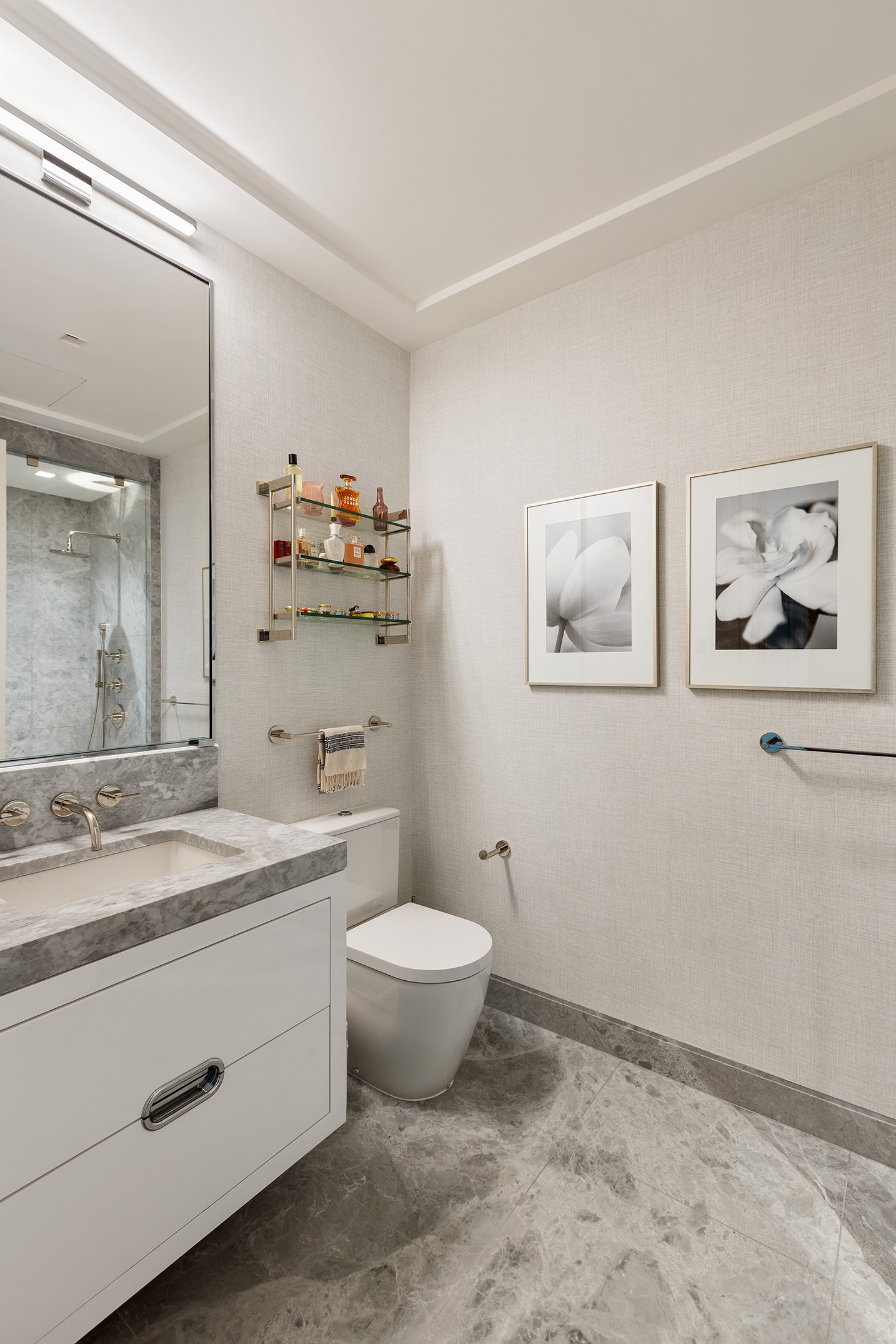 225 West 86th Street, Unit 1005 Manhattan, NY 10024 - Photo 14 of 15 a bathroom with a granite countertop sink mirror vanity and toilet
