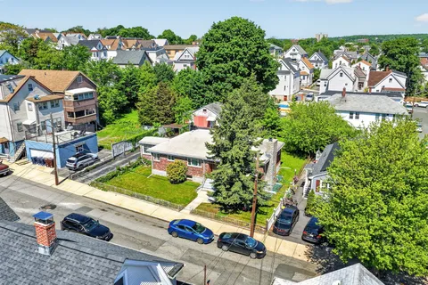 an aerial view of a house with a garden